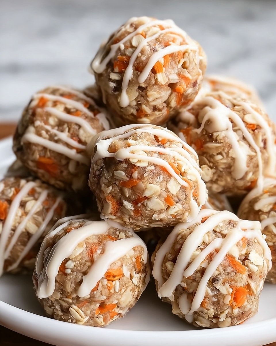 The image shows a pile of round energy balls stacked on a white plate, each ball having a rough texture with visible orange pieces embedded throughout, likely shredded carrot. The balls also have small oats or granola mixed within, giving them a grainy look. Each energy ball is drizzled with thin white icing in lines across the top, enhancing their detail. The close-up view highlights the mixture's dense texture and the contrast between the orange carrot bits and the light beige oats. The plate sits on a white marbled surface. photo taken with an iphone --ar 4:5 --v 7