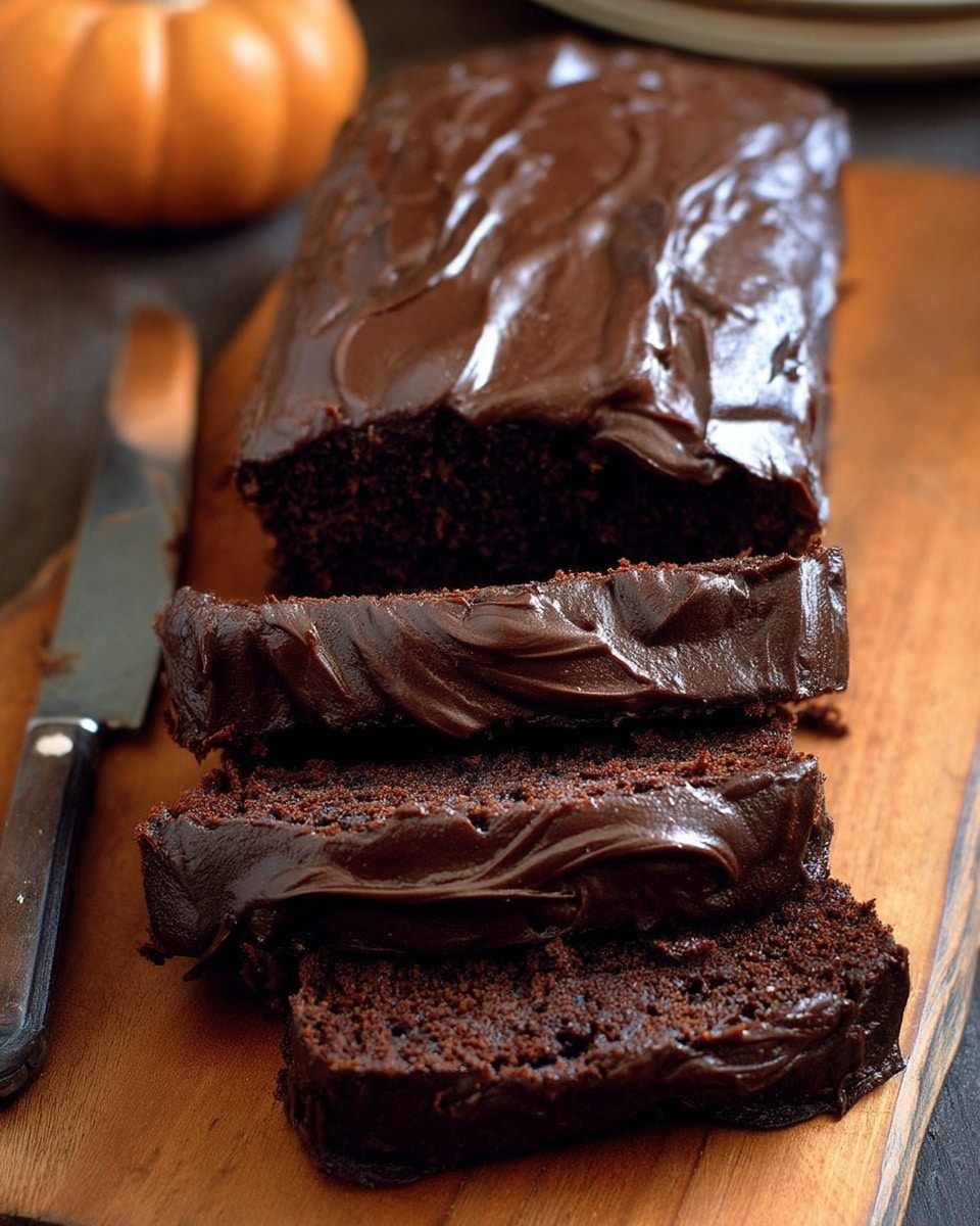 A close-up view of a rich chocolate cake slice, showing one thick layer of dark brown moist cake with a dense texture, topped with a smooth and glossy layer of dark chocolate frosting that covers the top and slightly drapes down the sides. The cake slice sits on a wooden surface. Photo taken with an iphone --ar 4:5 --v 7