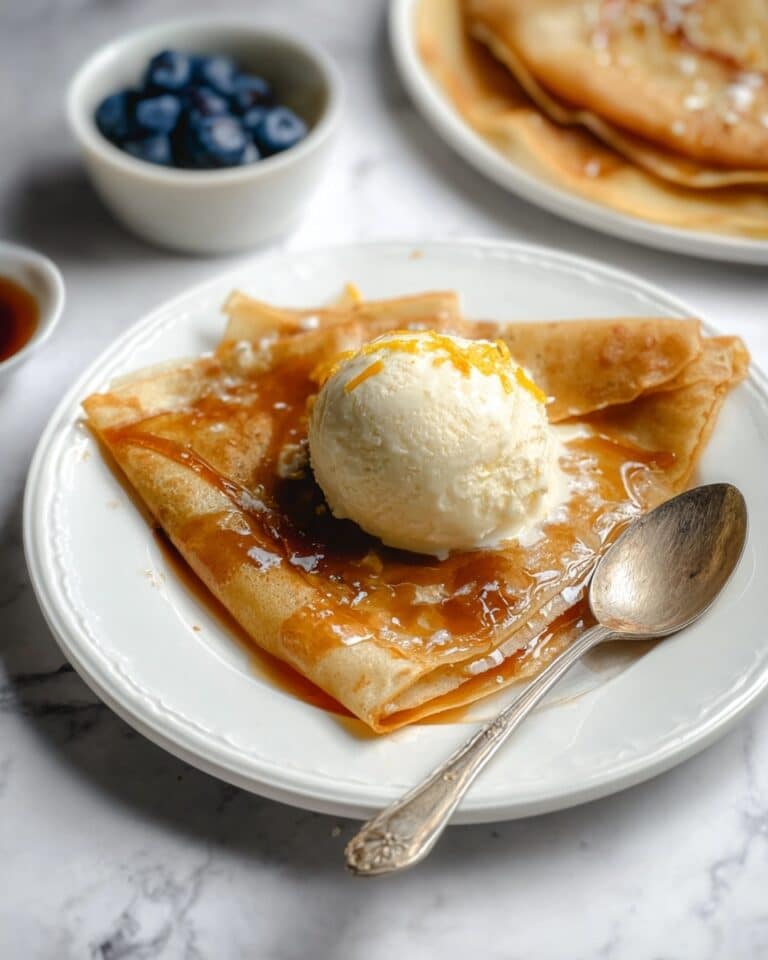 Orange Crepes with Citrus Blueberry Sauce and Vanilla Bean Ice Cream Recipe
