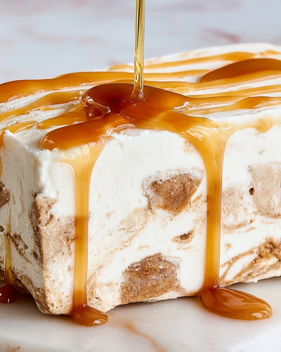 The image shows a dessert with multiple layers, placed on a white marbled surface. It has a total of six visible layers: the bottom layer is crumbly and brown, looking like cookie or biscuit, followed by a creamy white layer with pieces of light brown chunks mixed within. This pattern repeats three times, creating a thick, textured middle section. The top layer is smooth and glossy, covered with a shiny, bright amber caramel sauce that drips slightly on the sides. The dessert is sliced, revealing the layered texture inside, and there is a small piece cut off next to the main piece. photo taken with an iphone --ar 4:5 --v 7