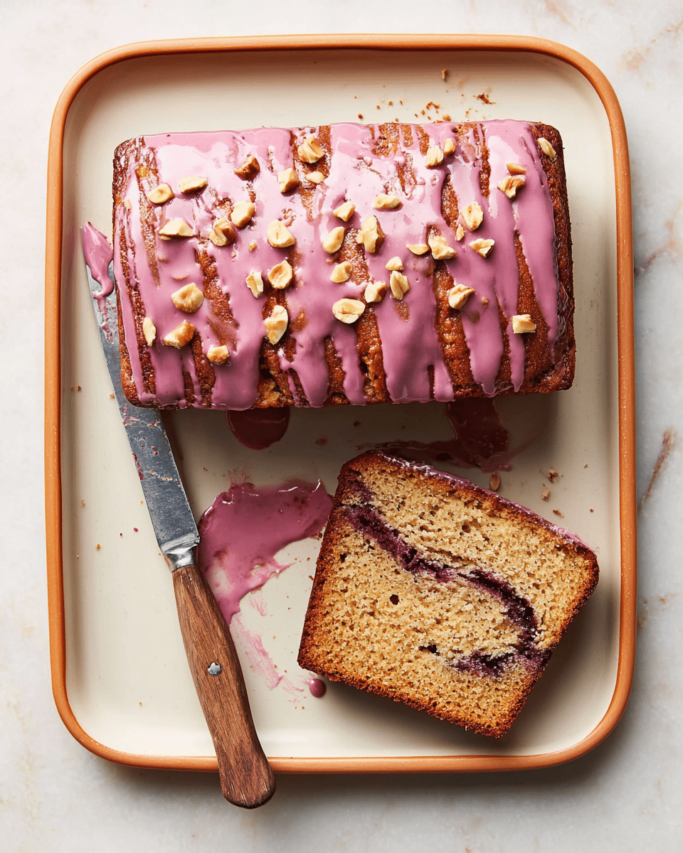 A rectangular loaf cake sits on a white rectangular tray with a light brown border, topped with thick, pinkish-purple glaze that drips down the sides unevenly. Chopped nuts are sprinkled mostly in the center of the glaze. One slice of the cake is cut and placed to the right of the loaf, showing a light brown crumb with a dark purple swirl inside. A knife with a wooden handle is placed diagonally at the lower right corner of the tray, with some glaze on its blade. The whole setup rests on a white marbled surface. photo taken with an iphone --ar 4:5 --v 7