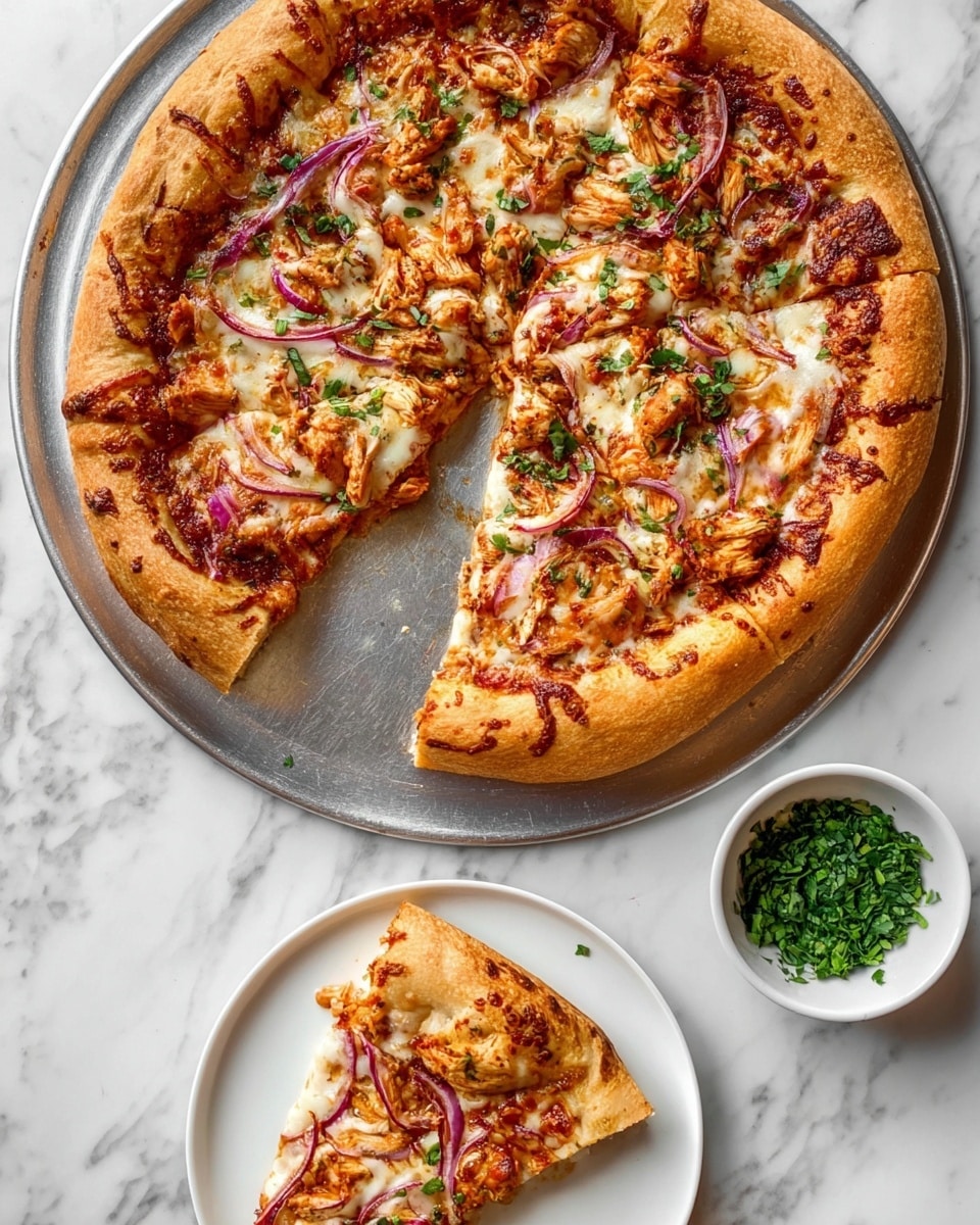 The image shows a large pizza with a thick golden-brown crust on a round silver tray, sitting on a white marbled surface. The pizza is sliced, with one slice pulled out onto a white plate below the tray. The pizza has a layer of melted mozzarella cheese that looks creamy and slightly browned, scattered pieces of reddish-brown chicken, thin slices of purple red onion, and some green herbs sprinkled on top. The pulled-out slice on the plate clearly displays the layers: a soft crust, reddish sauce, a thick layer of cheese with chicken pieces and onions on top. Nearby, there is a small bowl of chopped green herbs. Photo taken with an iphone --ar 4:5 --v 7