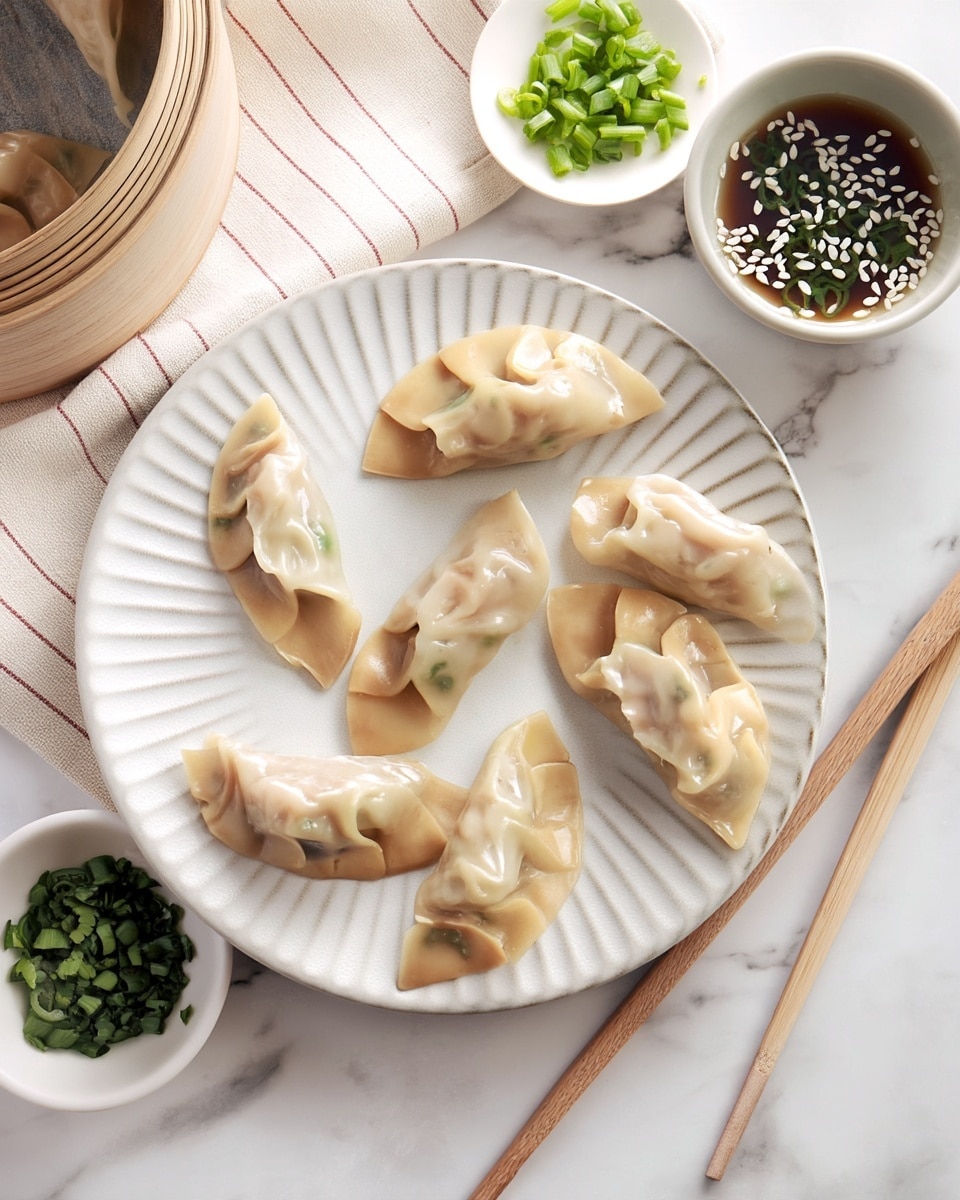 A white plate with a ridged pattern holds eight steamed dumplings arranged in a circle. Each dumpling has a pale golden, slightly translucent and soft skin with visible pleats and some green filling showing through. To the upper right of the plate is a small white bowl filled with dark soy sauce topped with white sesame seeds and chopped green onions. Nearby, there is a light beige cloth with thin red stripes, wooden chopsticks resting on the white marbled surface, and a bamboo steamer basket with a dumpling inside in the upper left corner. A small bowl with chopped green onions is partially visible in the lower left corner. Photo taken with an iphone --ar 4:5 --v 7